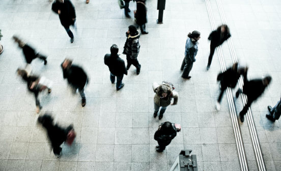 An overhead shot of people walking on a street.